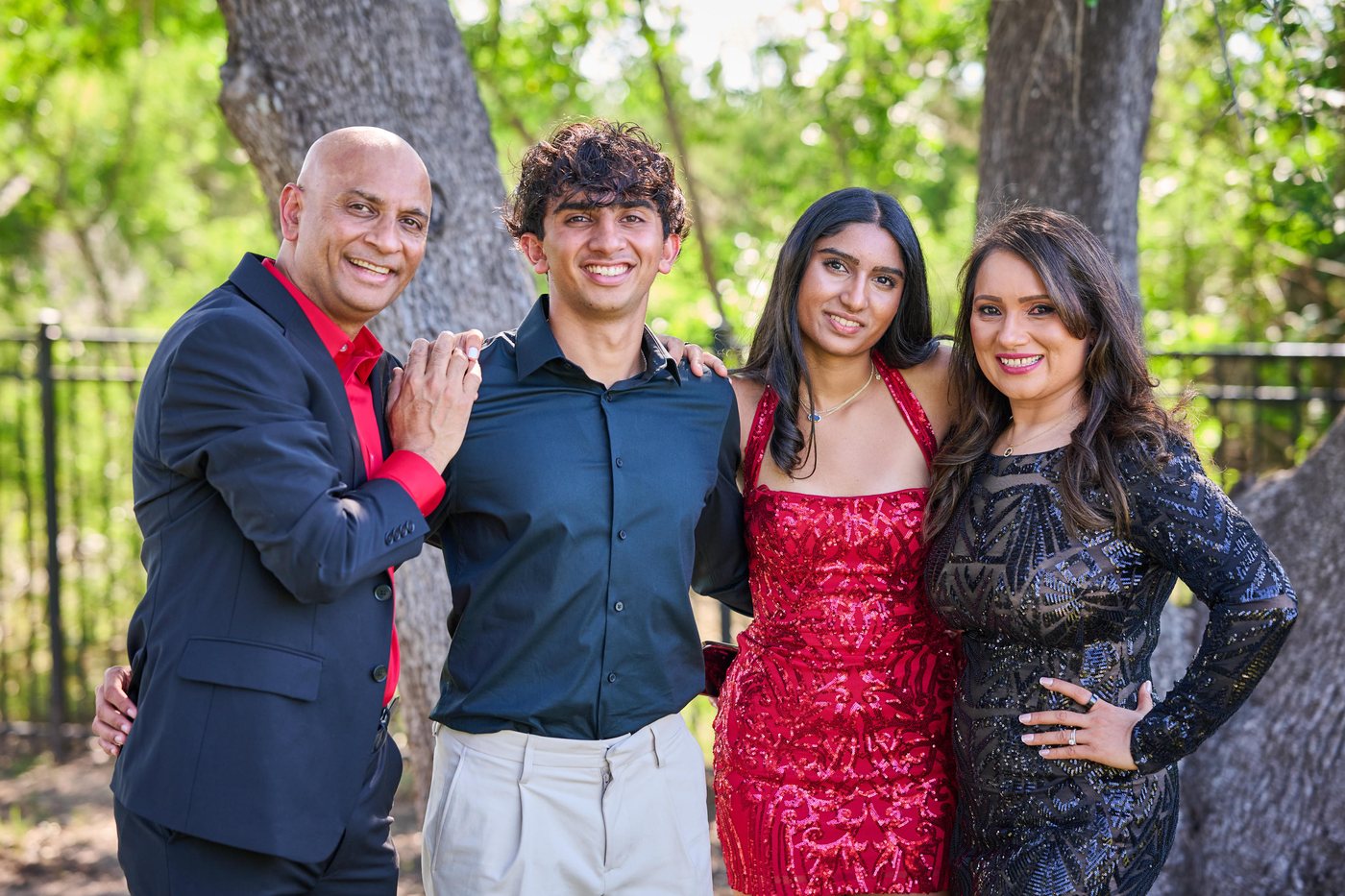 Rajiv (left) with family — outdoor portrait, my why